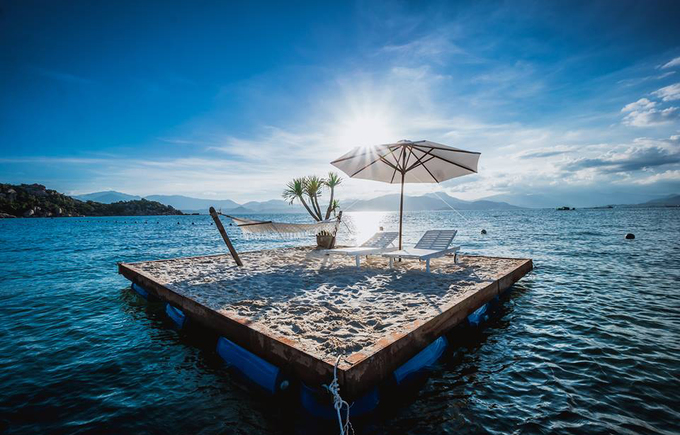 Bird's nest tent and stone cave house on the shore of Cam Ranh Bay