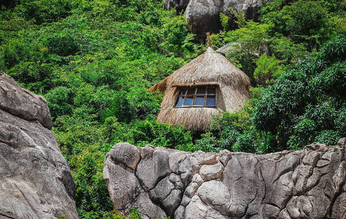 Bird's nest tent and stone cave house on the shore of Cam Ranh Bay