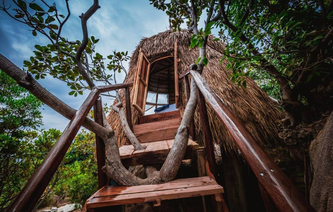 Bird's nest tent and stone cave house on the shore of Cam Ranh Bay