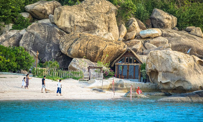 Bird's nest tent and stone cave house on the shore of Cam Ranh Bay