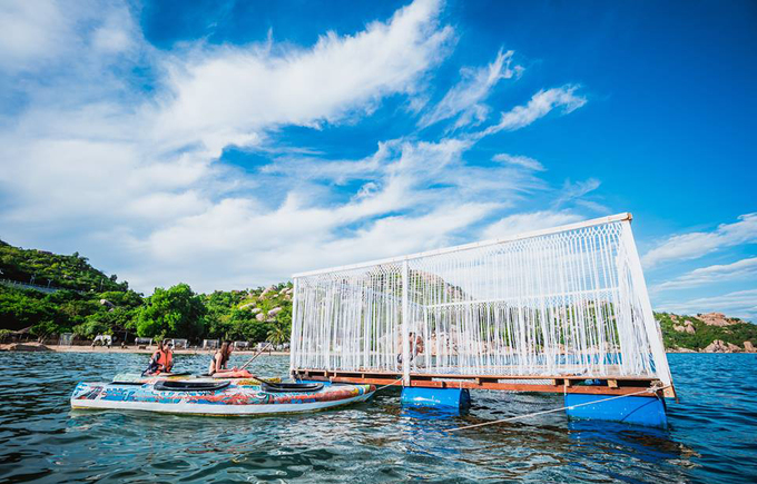 Bird's nest tent and stone cave house on the shore of Cam Ranh Bay